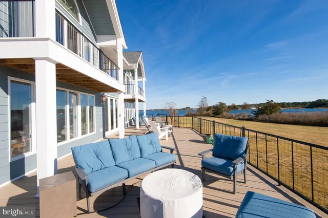 a bathroom with a double vanity sink a mirror and a bathtub