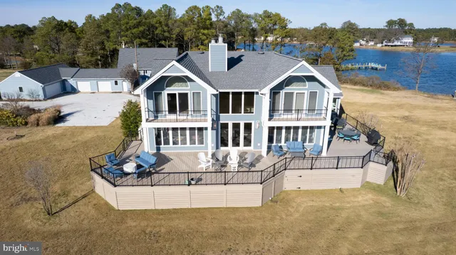 a hallway with a large window and a wooden floor