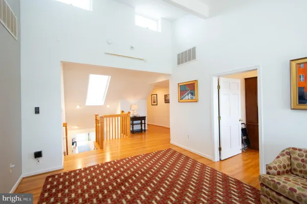 a living room with furniture and stairs