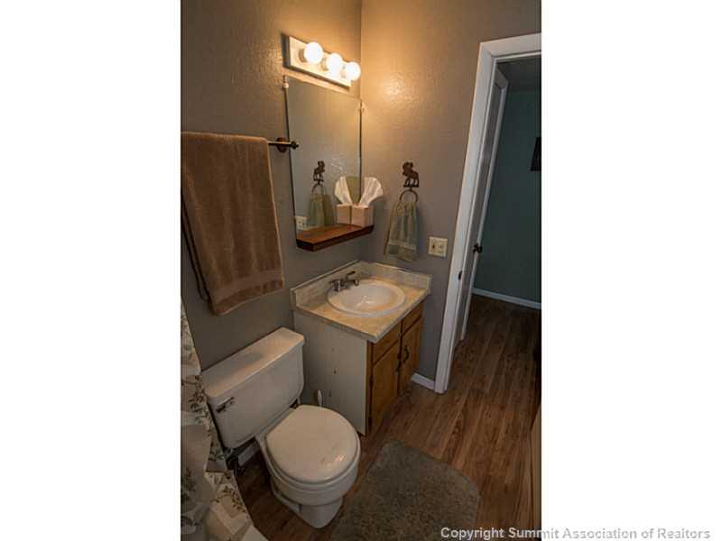 570 Bills Ranch Road, Unit A165 Frisco, CO 80443 - Photo 15 of 23 a bathroom with a toilet sink and mirror