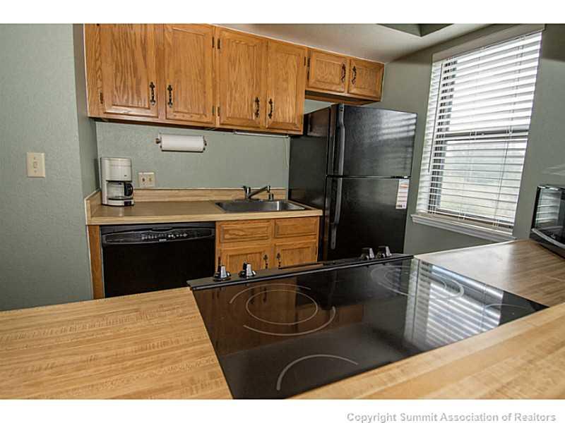 570 Bills Ranch Road, Unit A165 Frisco, CO 80443 - Photo 17 of 23 a kitchen with stainless steel appliances granite countertop a sink stove and refrigerator