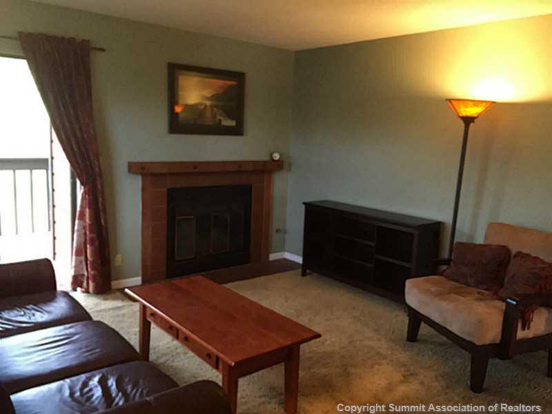 570 Bills Ranch Road, Unit A165 Frisco, CO 80443 - Photo 21 of 23 a living room with furniture and a fireplace