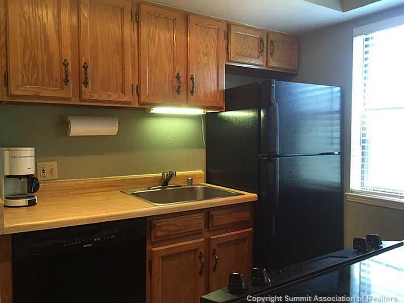 570 Bills Ranch Road, Unit A165 Frisco, CO 80443 - Photo 23 of 23 a kitchen with stainless steel appliances granite countertop a refrigerator and a sink