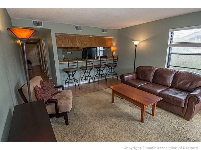570 Bills Ranch Road, Unit A165 Frisco, CO 80443 - Photo 4 of 23 a living room with furniture and a large window