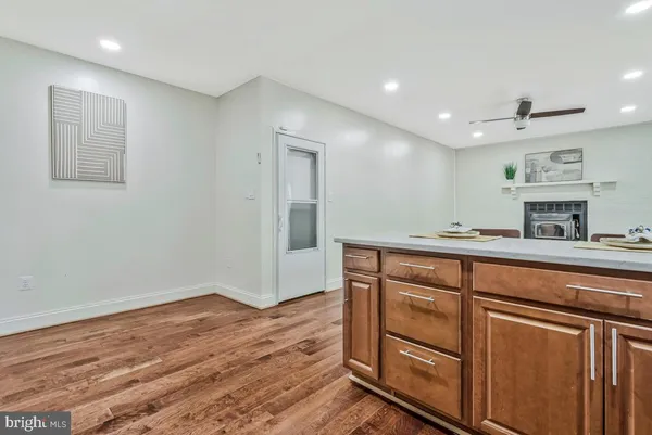 a view of cabinets a wooden floor and a window