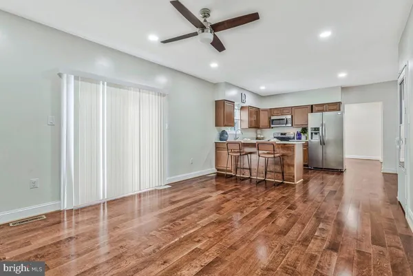 a kitchen with stainless steel appliances a refrigerator and microwave