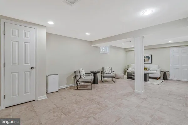 a bathroom with a toilet a sink and a mirror