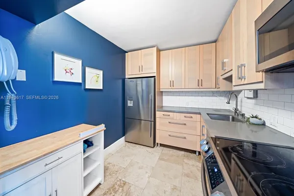 a kitchen with a stove oven and sink