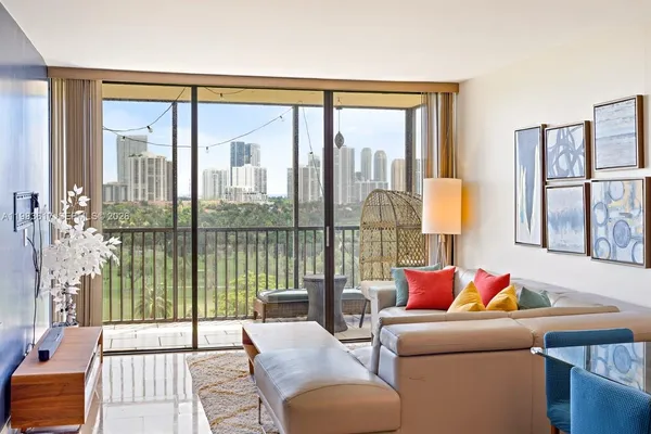 a living room with furniture and a large window