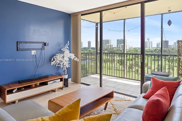 a reading room with furniture and a floor to ceiling window