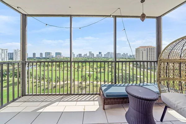 a view of a balcony with furniture