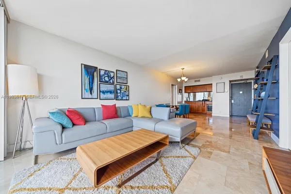 a living room with furniture and a rug