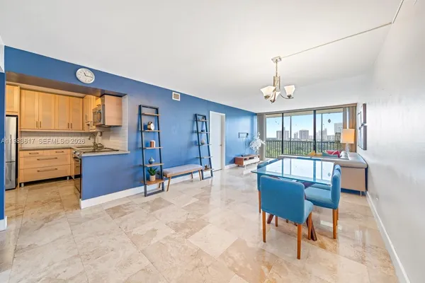 a dining room with furniture and window