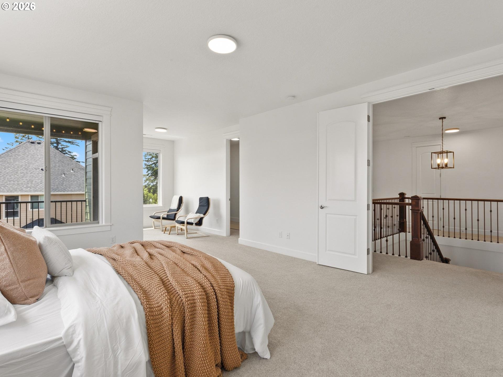 1012 Northwest Goodwin Street Camas, WA 98607 - Photo 18 of 44 a view of a bedroom with a bed and a window