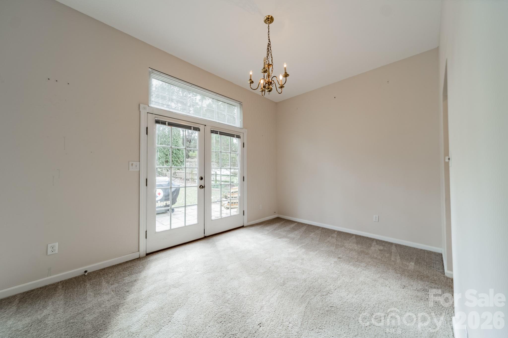 9409 Cedar River Road Huntersville, NC 28078 - Photo 13 of 31 a view of an empty room with a window