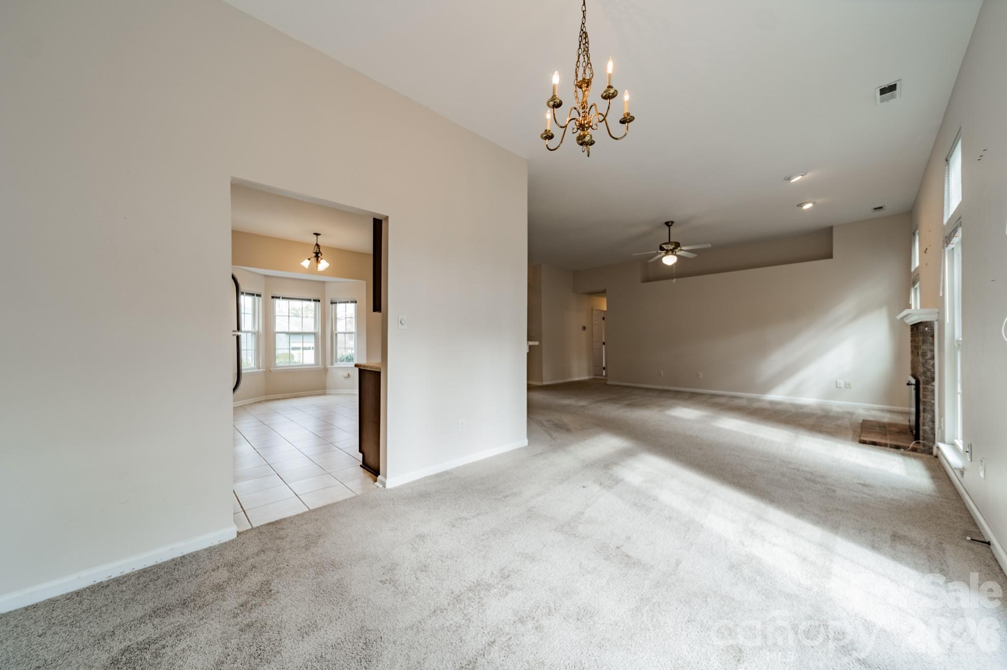 9409 Cedar River Road Huntersville, NC 28078 - Photo 14 of 31 wooden floor in an empty room with a window