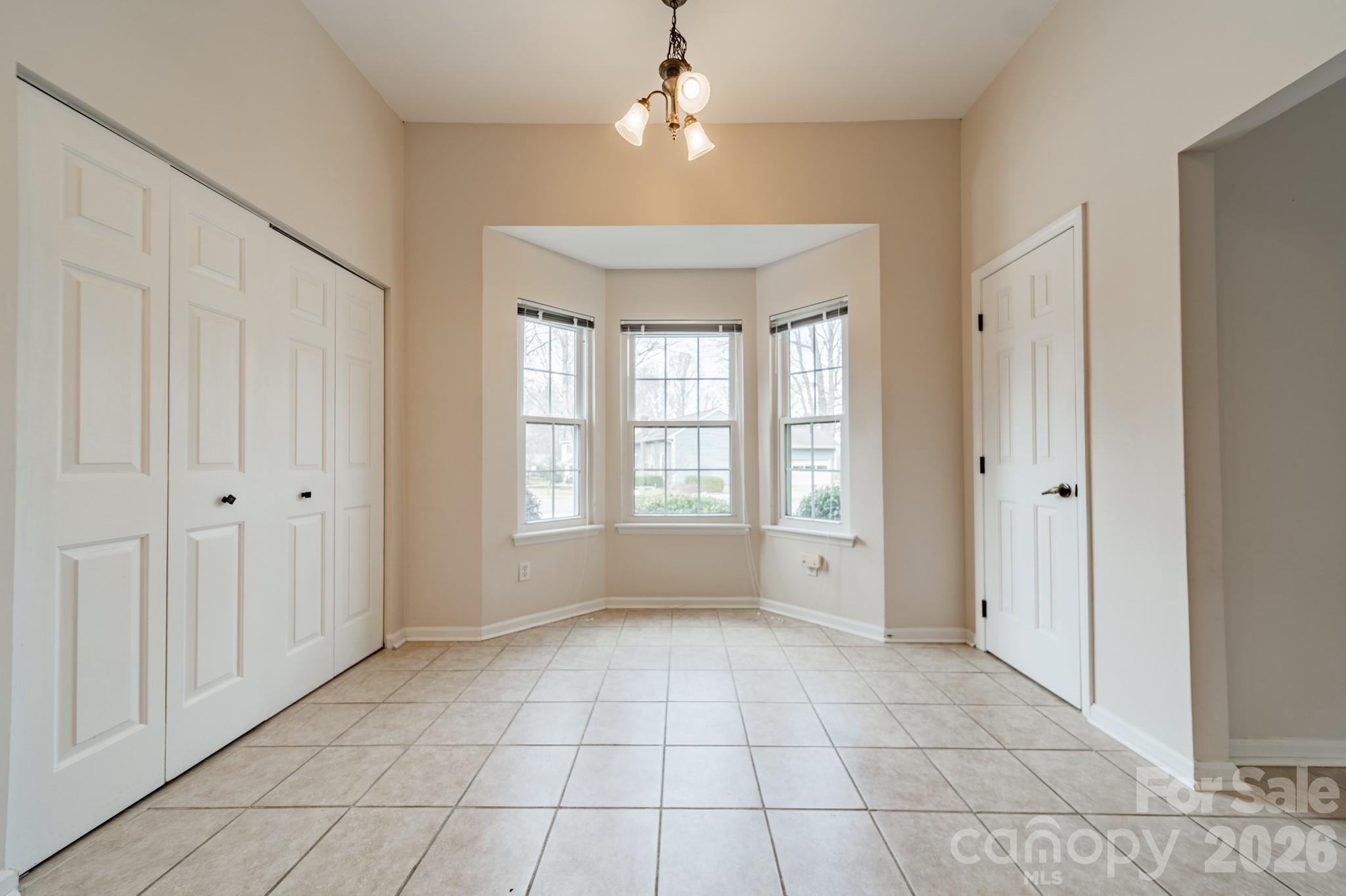 9409 Cedar River Road Huntersville, NC 28078 - Photo 19 of 31 a view of an empty room with a window