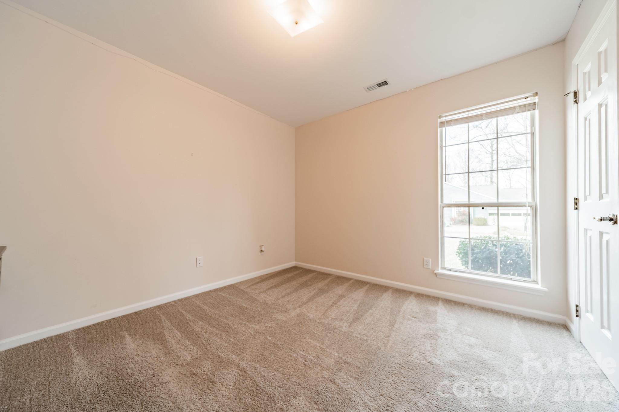 9409 Cedar River Road Huntersville, NC 28078 - Photo 21 of 31 an empty room with a window