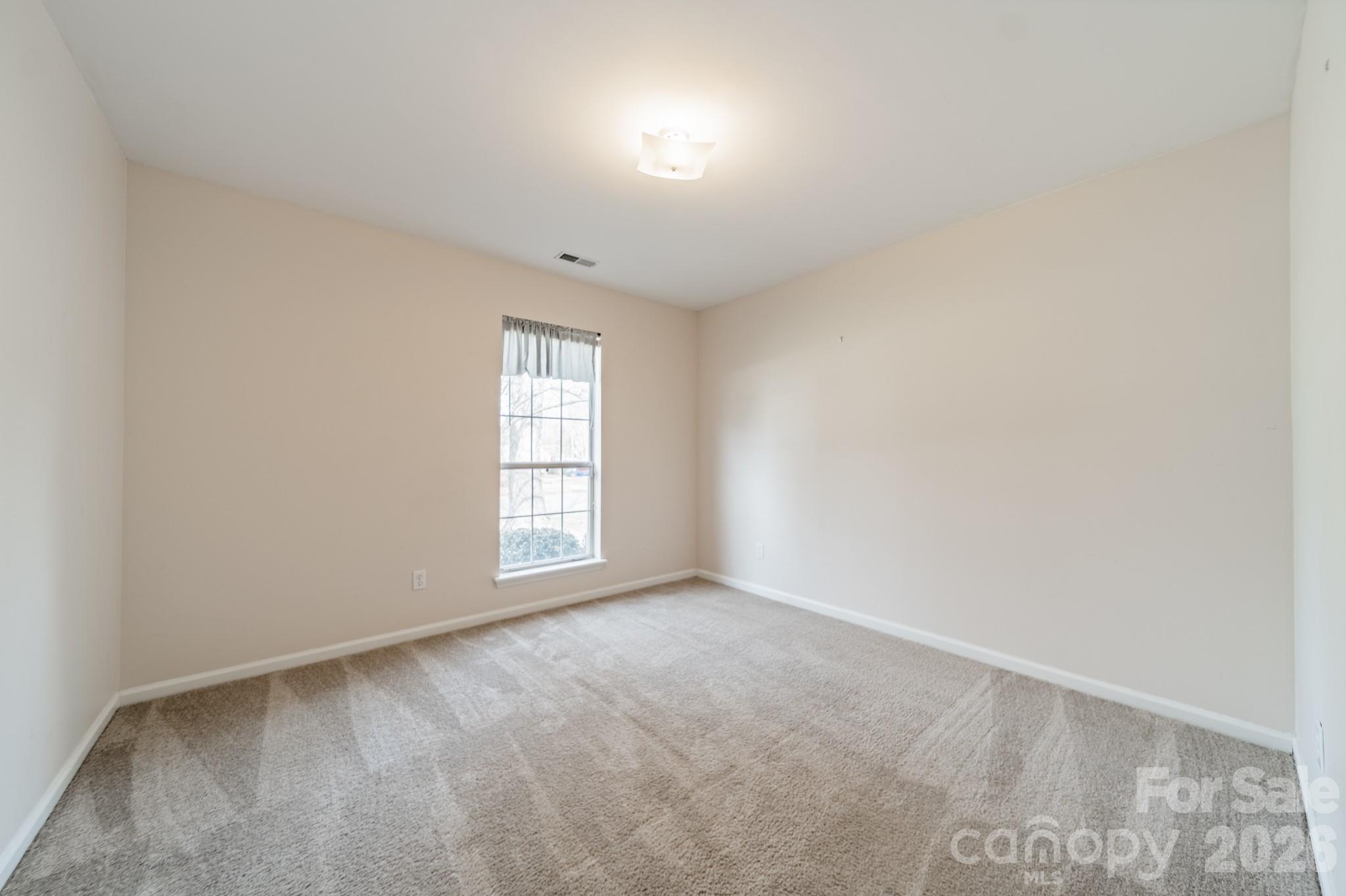 9409 Cedar River Road Huntersville, NC 28078 - Photo 23 of 31 an empty room with windows