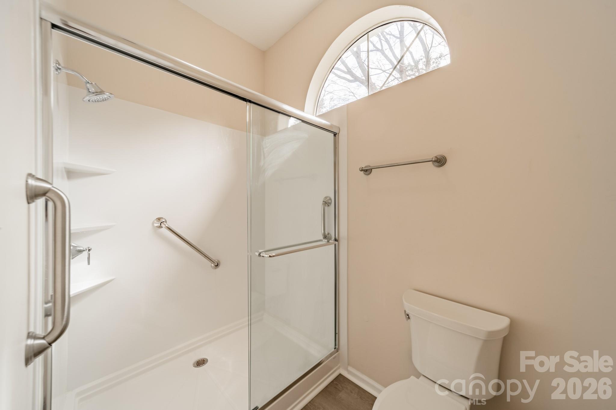 9409 Cedar River Road Huntersville, NC 28078 - Photo 30 of 31 a bathroom with a shower a toilet and a shower