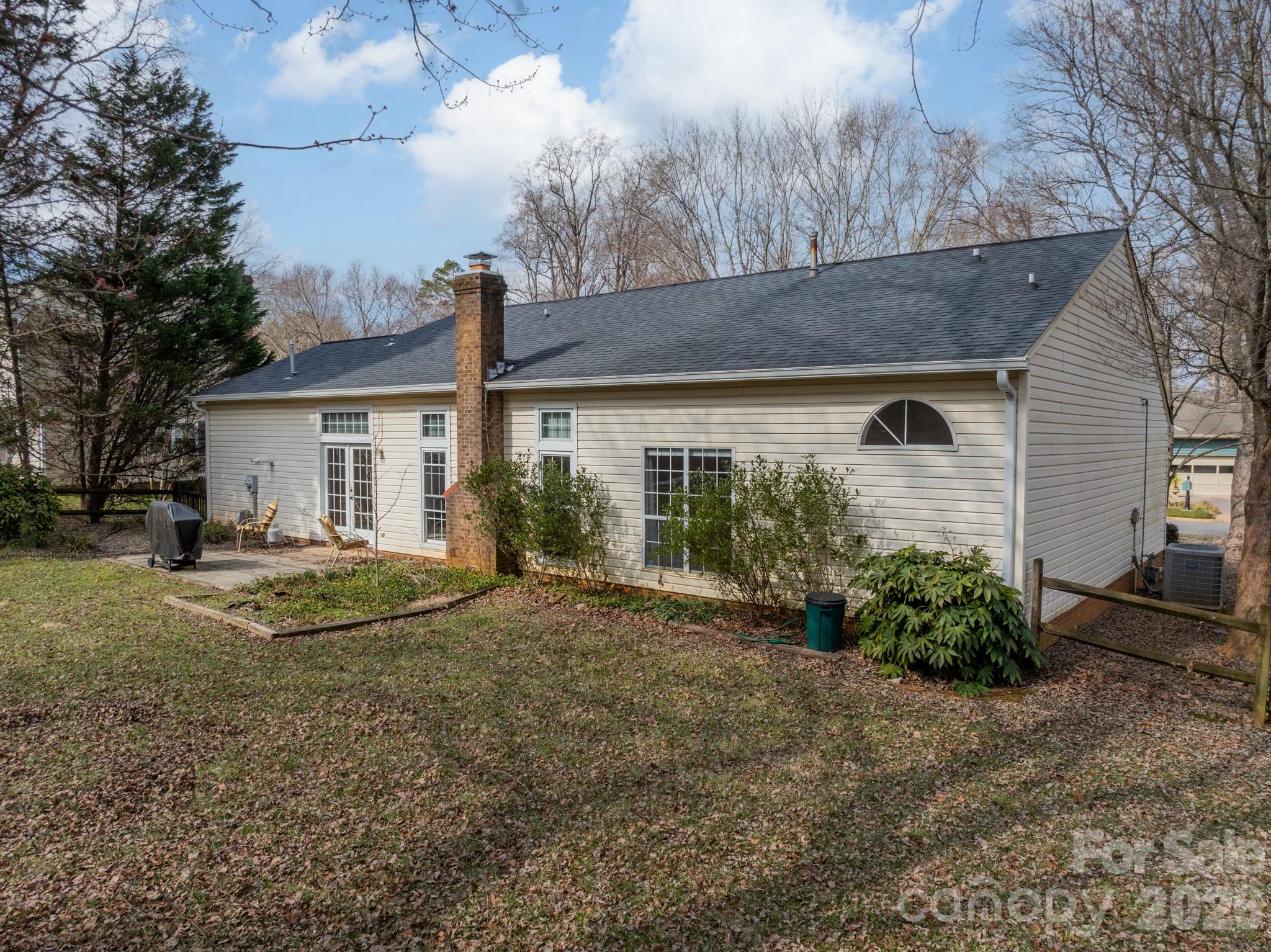 9409 Cedar River Road Huntersville, NC 28078 - Photo 5 of 31 a view of a house with backyard and garden