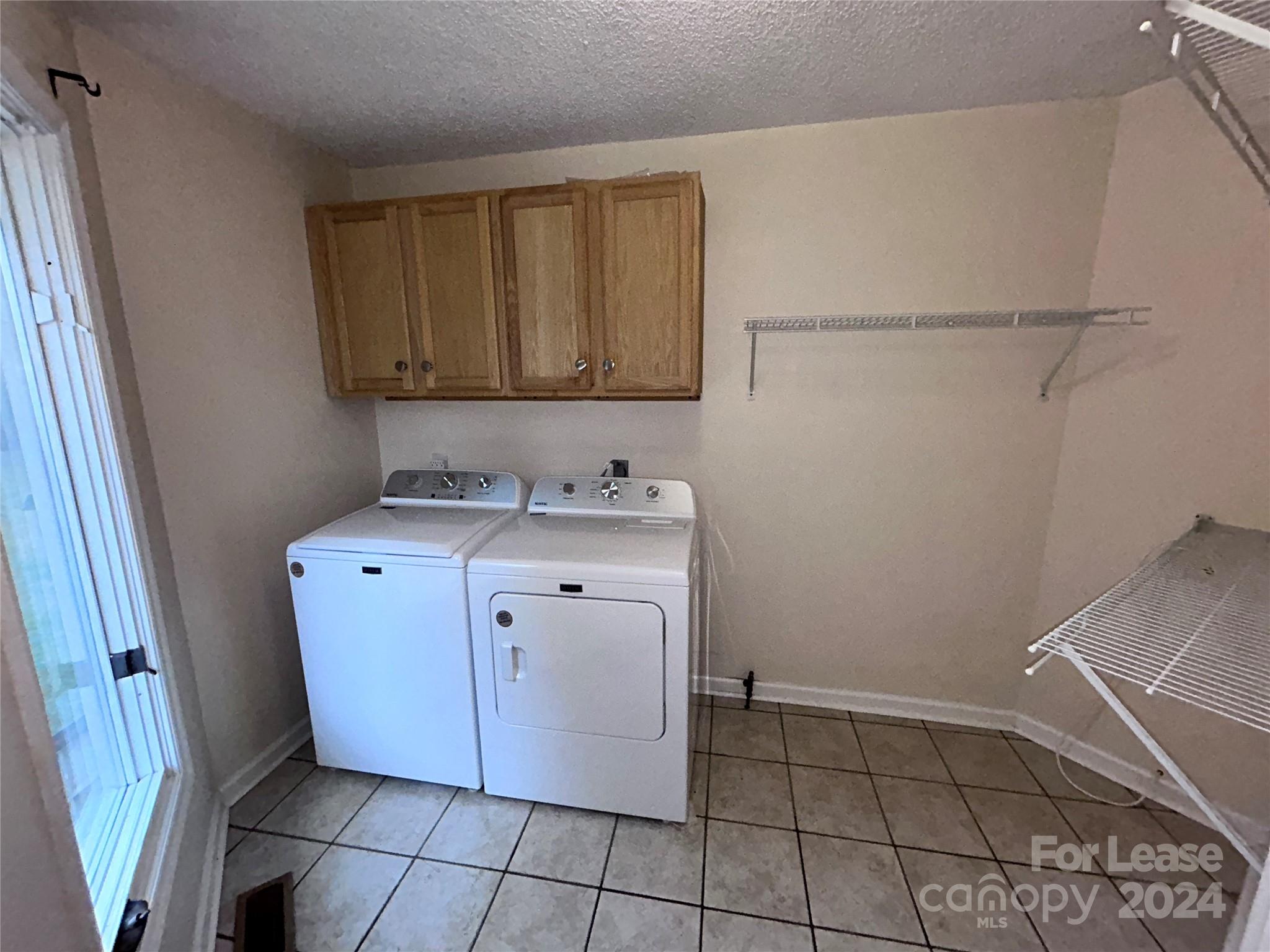 256 Spring Run Road Mooresville, NC 28117 - Photo 23 of 37 a utility room with a sink washer and dryer