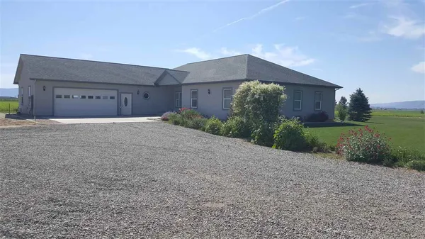 a house with a yard and a large parking space