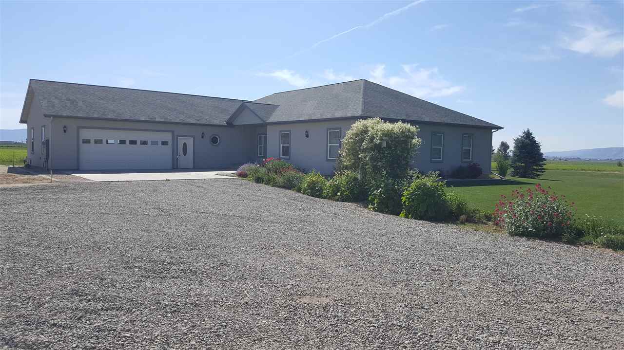 a house with a yard and a large parking space