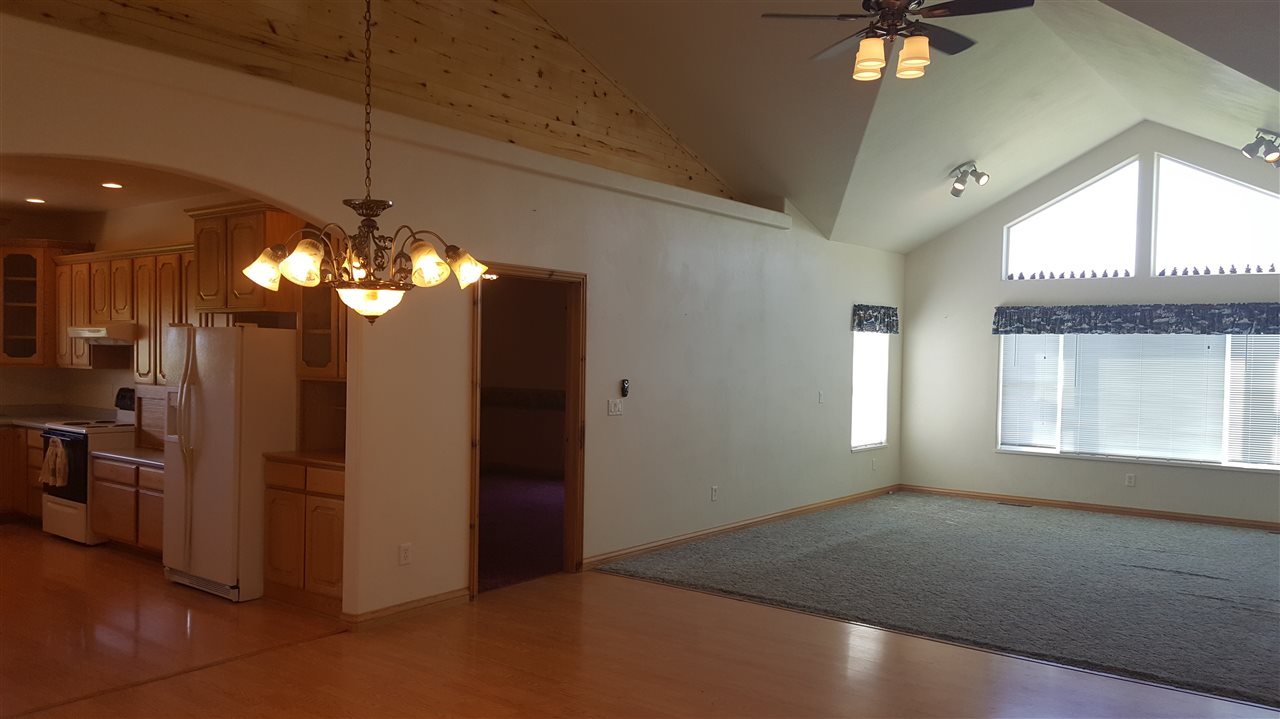 1247 Q Road Loma, CO 81524 - Photo 2 of 13 a view of a livingroom with a ceiling fan window and chandelier