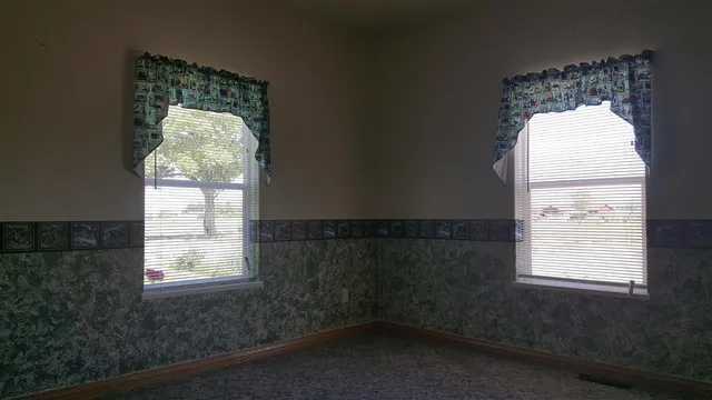 a view of a window in an empty room