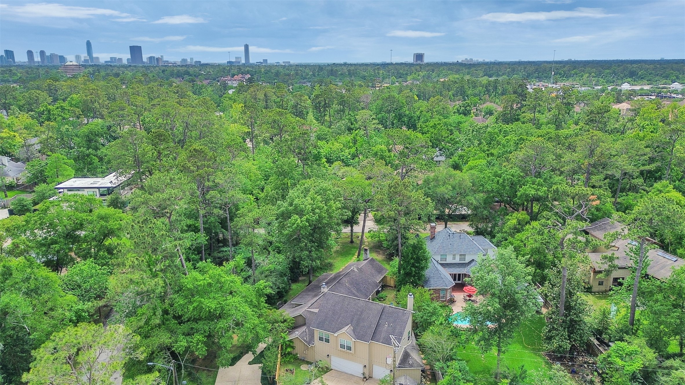8202 Burkhart Road Houston, TX 77055 - Photo 24 of 29 The house is in the foreground. It is very private among the trees and almost no neighbors looking into the property.