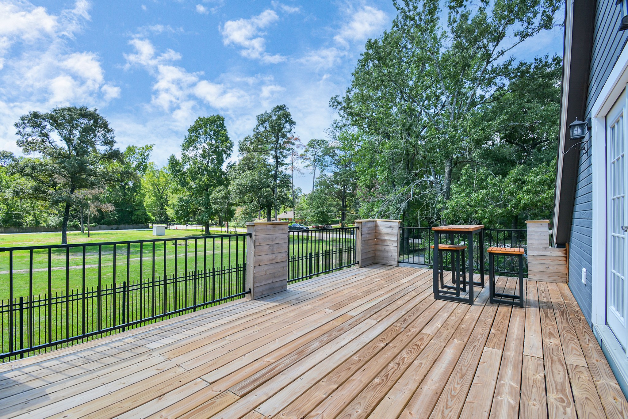 22936 Mossy Oaks Road Spring, TX 77389 - Photo 7 of 50 Balcony off of gameroom overlooks beautiful and lush land. Perfect spot for sunsets