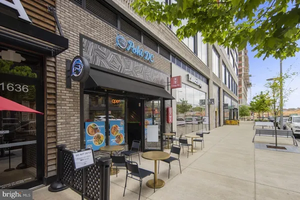 a front view of a building with retail shops