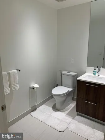 a bathroom with a toilet sink and shower