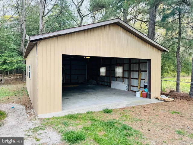 a view of house with backyard and entertaining space