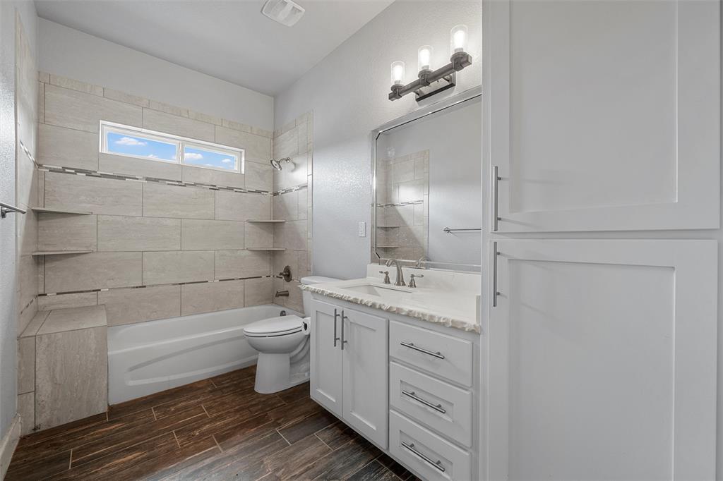 2662 Snow Road Kempner, TX 76539 - Photo 26 of 40 a bathroom with a double vanity sink toilet and shower