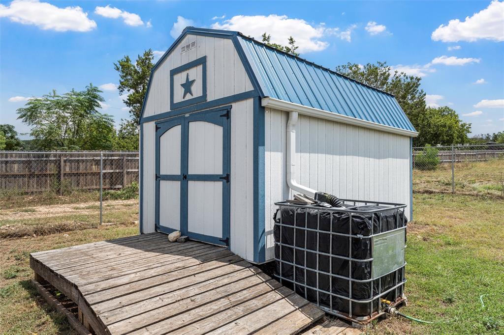 2662 Snow Road Kempner, TX 76539 - Photo 33 of 40 a view of a wooden deck and a backyard