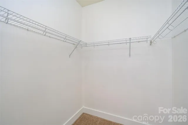 a view of a room with racks on the wall