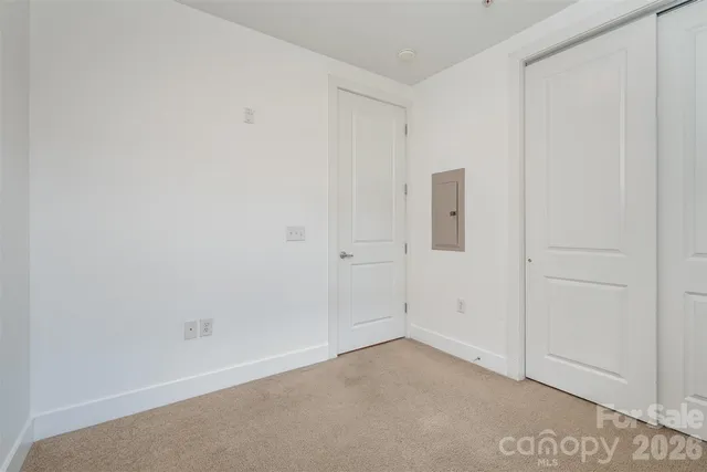 a bathroom with a granite countertop sink toilet a mirror and shower