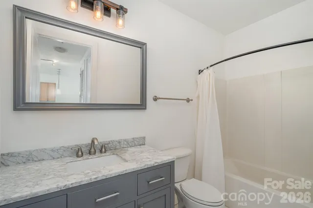 a view of a storage and utility room with washer and dryer
