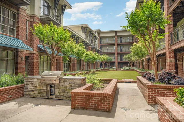 a view of a building with a yard