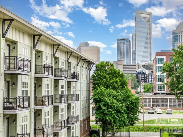 a view of a building with a lot of windows and entertaining space