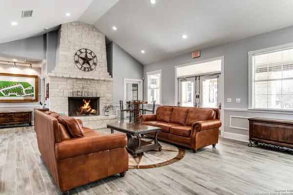 a living room with furniture and a fireplace