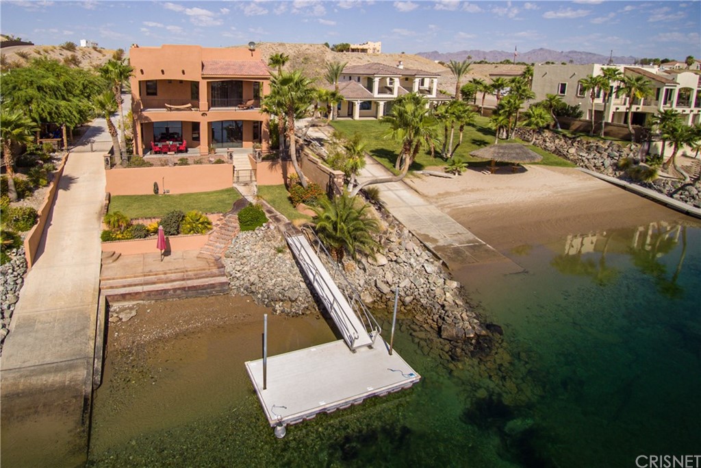 an aerial view of a house with outdoor space