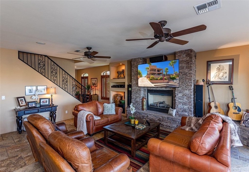 4654 My Place Road Needles, CA 92363 - Photo 11 of 75 a living room with furniture and a fireplace