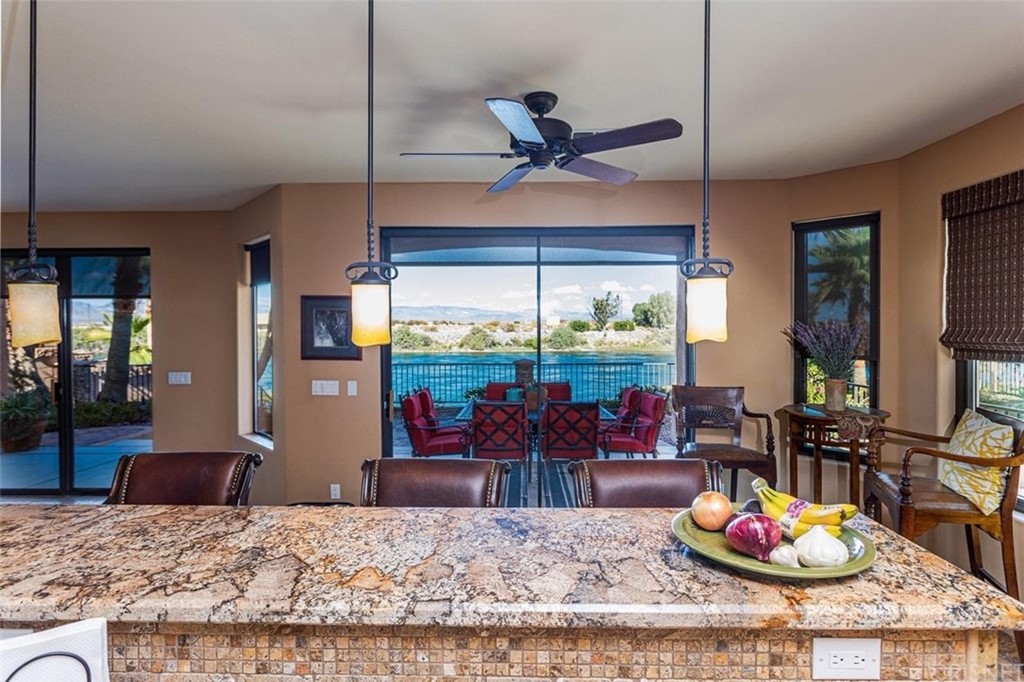 4654 My Place Road Needles, CA 92363 - Photo 18 of 75 a living room with granite countertop wooden floor and floor to ceiling window