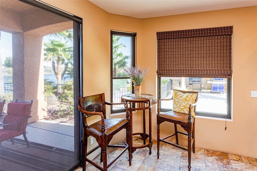 4654 My Place Road Needles, CA 92363 - Photo 23 of 75 a dining room with furniture and a window