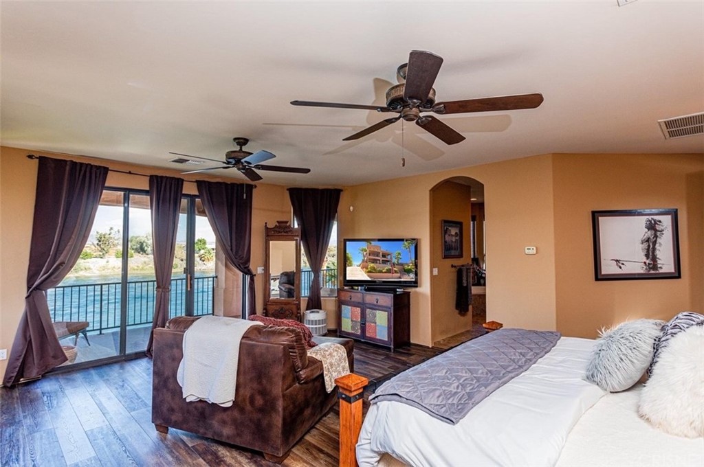 4654 My Place Road Needles, CA 92363 - Photo 25 of 75 a bedroom with a bed dresser and a window