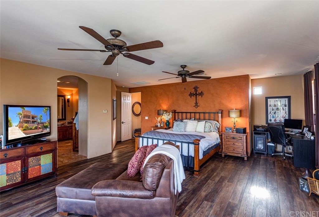 4654 My Place Road Needles, CA 92363 - Photo 26 of 75 a room with a bed and a flat screen tv