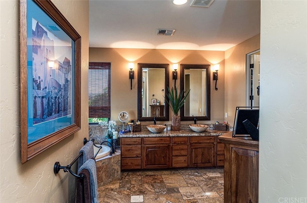 4654 My Place Road Needles, CA 92363 - Photo 27 of 75 Large Master Bath offers dual sinks, granite counter top, custom lighting, large graden tub, huge walk-in custom tile shower, custom tile flooring and a large walk-in closet with built-in shelving.